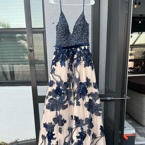 Size 8 prom dress, never worn new with tags.